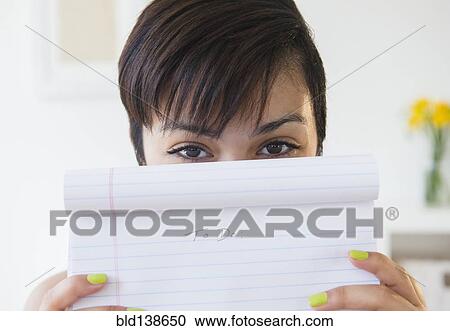 Mixed race woman holding empty to do list View Large Photo Image Stock Image - Mixed race woman holding empty to do list. Fotosearch