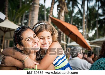 Mother and daughter hugging outdoors View Large Photo Image Stock Photography - Mother and daughter hugging outdoors. Fotosearch