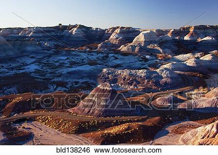 Stock Photograph - Multicolor rock formations in mountainous remote landscape, Petrified Forest National Park, Arizona, United States. Fotosearch