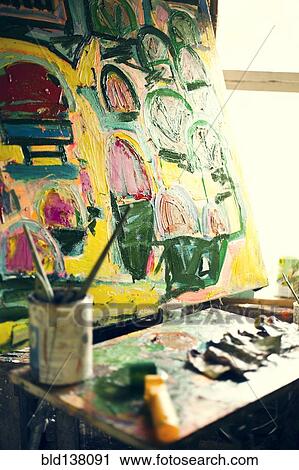 Paint brushes and painting in art studio View Large Photo Image Stock Image - Paint brushes and painting in art studio. Fotosearch