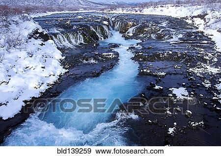 River flowing from waterfall, Bruarfoss, Sudhurland, Iceland View Large Photo Image Stock Photo - River flowing from waterfall, Bruarfoss, Sudhurland, Iceland. Fotosearch