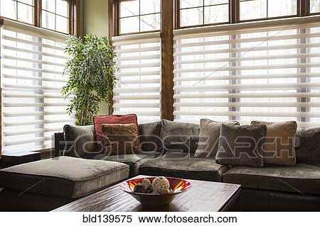 Stock Photography - Sofa and blinds in living room. Fotosearch