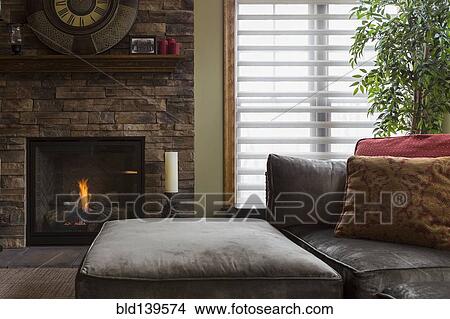 Picture - Sofa and fireplace in living room. Fotosearch