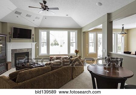 Sofa, counter table, fireplace and television in modern living room View Large Photo Image Stock Photo - Sofa, counter table, fireplace and television in modern living room. Fotosearch