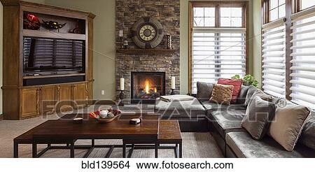 Picture - Sofa, television and fireplace in living room. Fotosearch