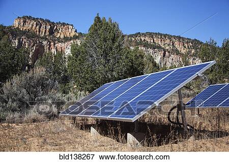 Solar panels in remote field near mountains, Zion National Park, Utah, United States View Large Photo Image Stock Photo - Solar panels in remote field near mountains, Zion National Park, Utah, United States. Fotosearch