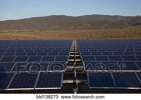 Stock Image - Solar panels in remote landscape. Fotosearch
