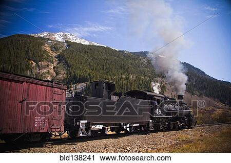 Steam train near mountain View Large Photo Image Stock Image - Steam train near mountain. Fotosearch