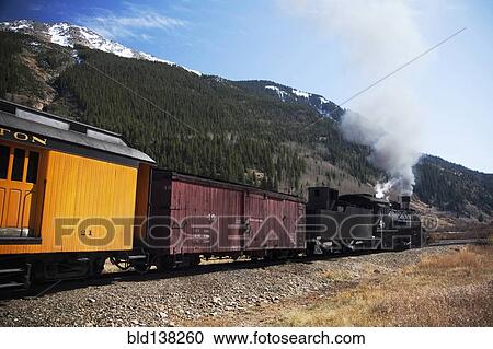 Steam train near mountain View Large Photo Image Stock Image - Steam train near mountain. Fotosearch