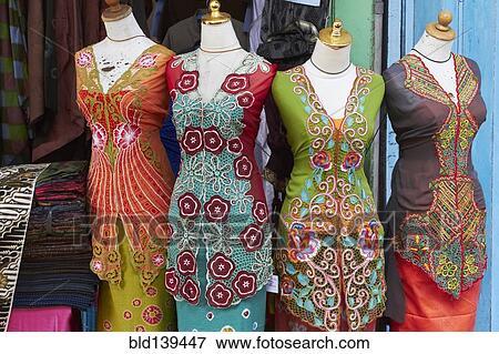 Traditional sarongs on mannequins at market View Large Photo Image Stock Photo - Traditional sarongs on mannequins at market. Fotosearch