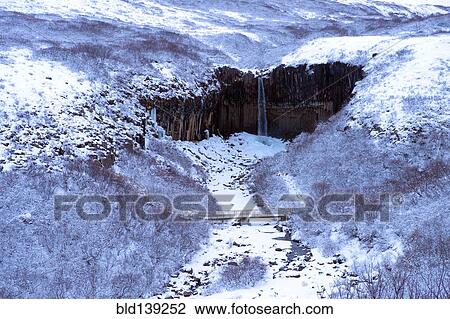 Waterfall and river in snowy landscape, Svartifoss, Sudhurland, Iceland View Large Photo Image Stock Image - Waterfall and river in snowy landscape, Svartifoss, Sudhurland, Iceland. Fotosearch