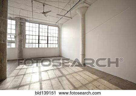 Stock Image - Window shadows in empty loft. Fotosearch