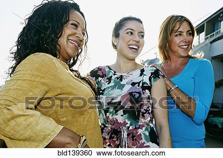 Women relaxing together View Large Photo Image Stock Image - Women relaxing together. Fotosearch