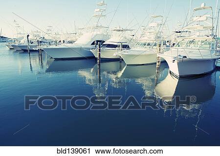 Yachts docked in harbor View Large Photo Image Stock Image - Yachts docked in harbor. Fotosearch