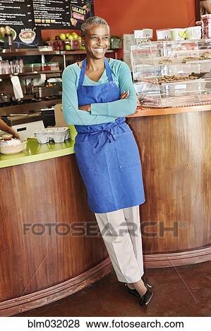 Black server smiling in cafe View Large Photo Image Stock Photo - Black server smiling in cafe. Fotosearch