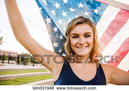 Stock Photo - Caucasian teenage girl holding American flag. Fotosearch