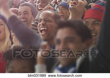 Fans cheering at American football game View Large Photo Image Stock Photo - Fans cheering at American football game. Fotosearch