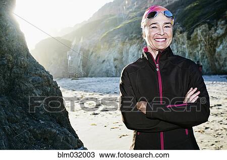 Older Caucasian woman wearing goggles on beach View Large Photo Image Stock Image - Older Caucasian woman wearing goggles on beach. Fotosearch