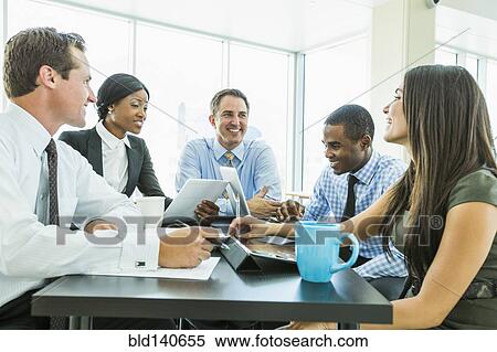 Stock Photography - Business people talking in meeting. Fotosearch