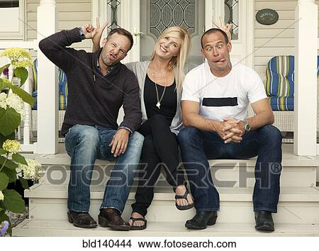 Caucasian adults smiling together on front porch View Large Photo Image Picture - Caucasian adults smiling together on front porch. Fotosearch