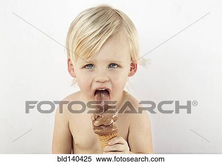 Caucasian boy licking chocolate ice cream cone View Large Photo Image Stock Photography - Caucasian boy licking chocolate ice cream cone. Fotosearch