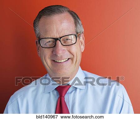 Caucasian businessman smiling View Large Photo Image Stock Photo - Caucasian businessman smiling. Fotosearch