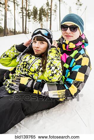 Caucasian couple sitting in snow View Large Photo Image Stock Photography - Caucasian couple sitting in snow. Fotosearch