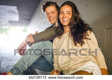 Caucasian couple smiling in tunnel View Large Photo Image Stock Image - Caucasian couple smiling in tunnel. Fotosearch