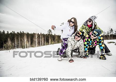 Caucasian friends smiling in snow View Large Photo Image Stock Image - Caucasian friends smiling in snow. Fotosearch