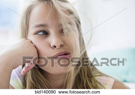 Caucasian girl blowing hair from her face View Large Photo Image Stock Image - Caucasian girl blowing hair from her face. Fotosearch