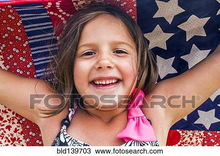 Caucasian girl holding blanket View Large Photo Image Stock Image - Caucasian girl holding blanket. Fotosearch