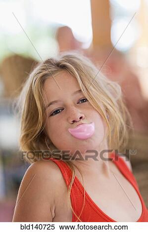 Stock Photography - Caucasian girl wearing fake lips. Fotosearch
