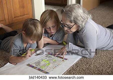 Caucasian grandmother and grandchildren coloring together on floor View Large Photo Image Stock Image - Caucasian grandmother and grandchildren coloring together on floor. Fotosearch