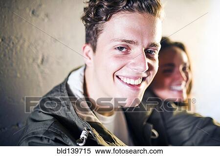 Stock Photography - Caucasian man relaxing with girlfriend. Fotosearch