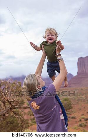 Caucasian mother and son playing in desert, Monument Valley, Utah, United States View Large Photo Image Stock Photograph - Caucasian mother and son playing in desert, Monument Valley, Utah, United States. Fotosearch