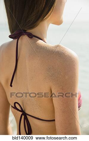Caucasian woman covered in sand View Large Photo Image Stock Photo - Caucasian woman covered in sand. Fotosearch