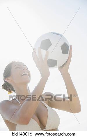 Caucasian woman holding soccer ball outdoors View Large Photo Image Stock Photography - Caucasian woman holding soccer ball outdoors. Fotosearch