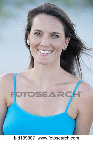 Stock Photo - Caucasian woman smiling outdoors. Fotosearch