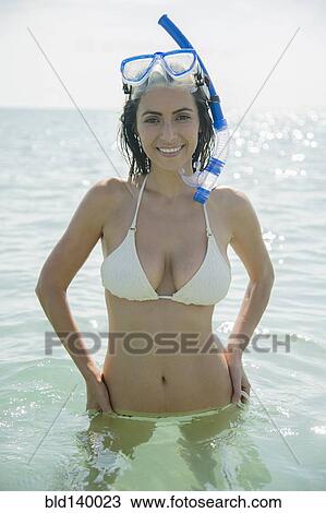 Caucasian woman wearing snorkel and mask in ocean View Large Photo Image Stock Image - Caucasian woman wearing snorkel and mask in ocean. Fotosearch