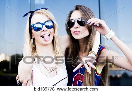 Caucasian women smiling in city View Large Photo Image Stock Photo - Caucasian women smiling in city. Fotosearch