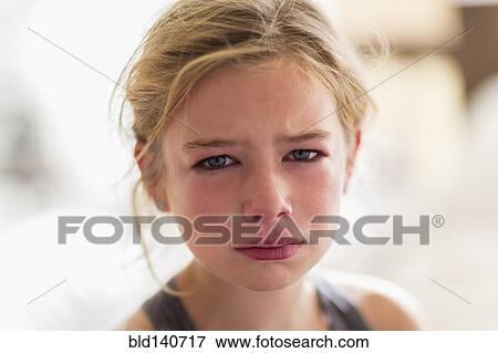 Close up of red face of crying Caucasian girl View Large Photo Image Stock Photo - Close up of red face of crying Caucasian girl. Fotosearch