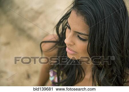 Stock Image - Close up of woman on beach. Fotosearch