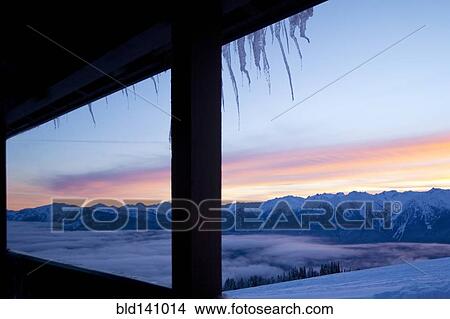 Colorful sky over snow covered mountains in remote landscape View Large Photo Image Picture - Colorful sky over snow covered mountains in remote landscape. Fotosearch