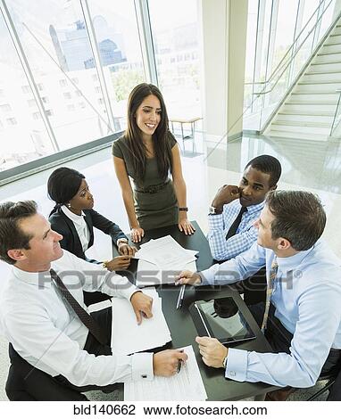 High angle view of business people talking in meeting View Large Photo Image Stock Image - High angle view of business people talking in meeting. Fotosearch