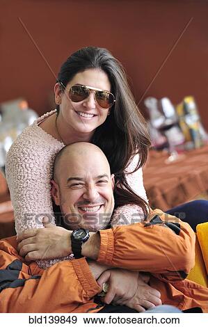 Stock Photo - Hispanic couple hugging. Fotosearch