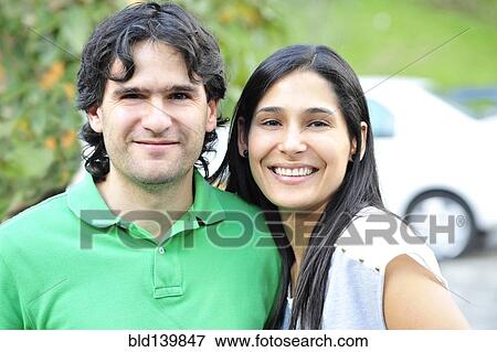 Stock Photo - Hispanic couple smiling together. Fotosearch