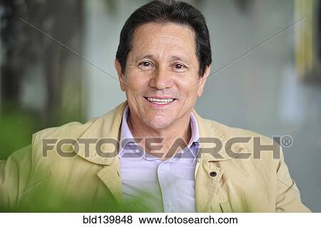 Stock Photo - Hispanic man smiling. Fotosearch