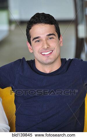 Stock Photography - Hispanic man smiling. Fotosearch