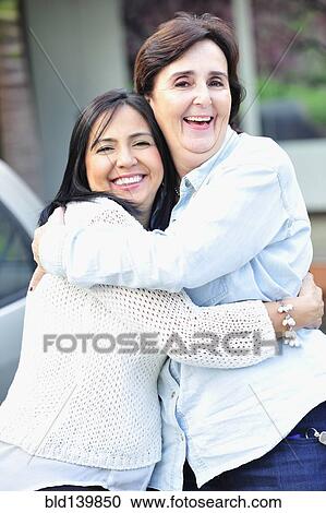 Hispanic women hugging View Large Photo Image Stock Image - Hispanic women hugging . Fotosearch