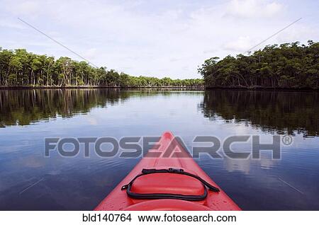Picture - Kayak floating in lake. Fotosearch